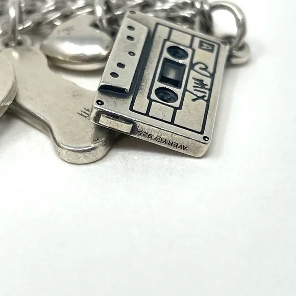 JAMES AVERY sterling silver charm bracelet, 8 charms Bracelets